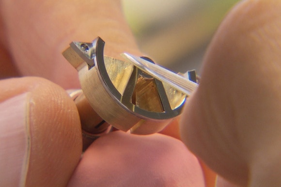 Close up of watch part made by hand